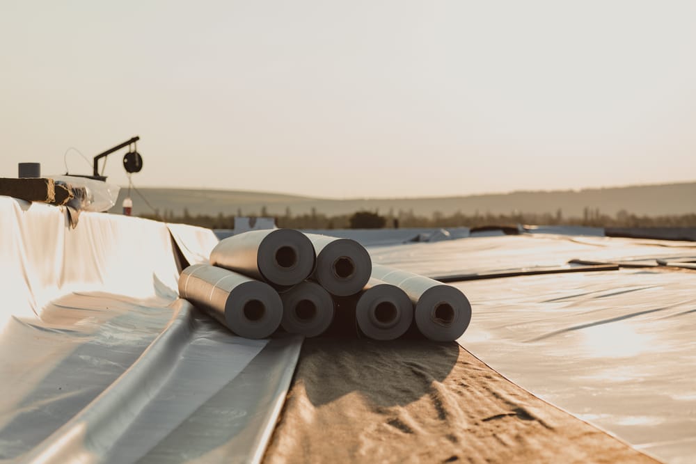 Roofing PVC membrane in rolls placed on the roof of a hall.Rubber membrane ready to be mounted.